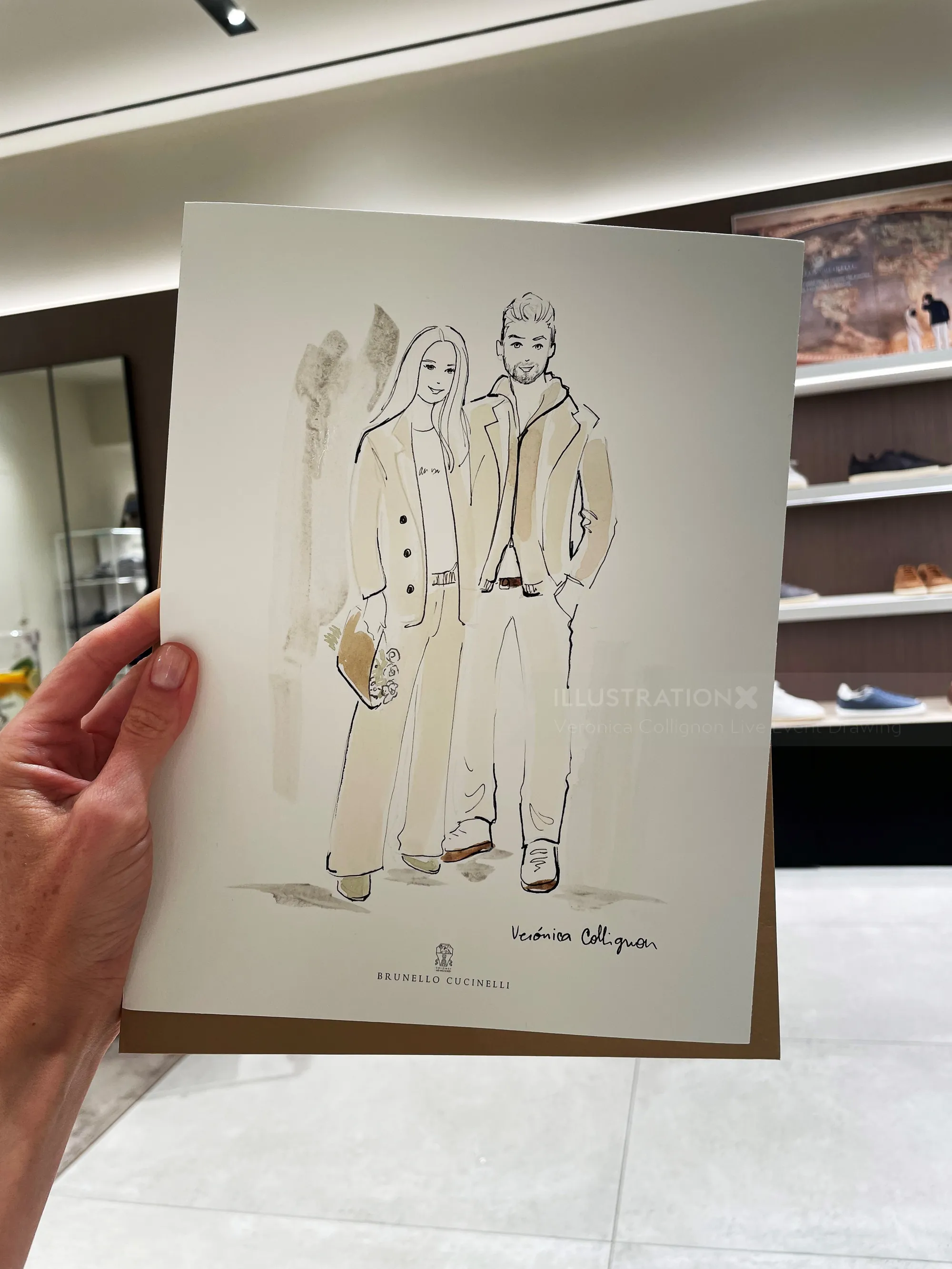 Fashion illustration of a man and woman held in a hand