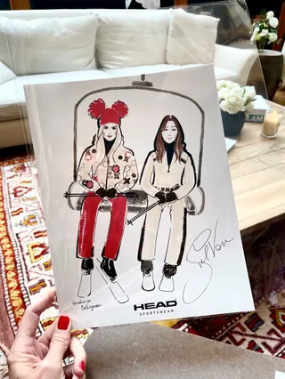 Fashion sketch of two women on ski lift in winter clothing