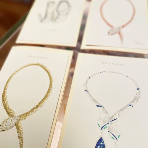 Drawings of various elegant necklaces with gemstones on display cards