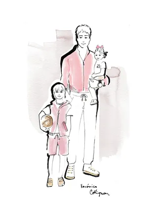Father standing with two children, one holding a ball