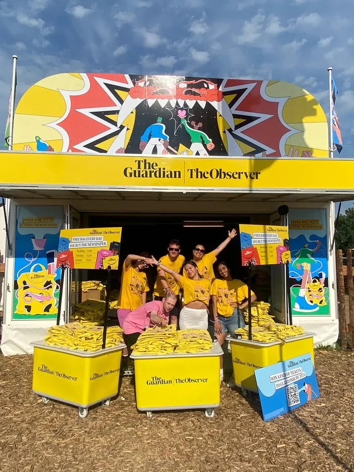 Festival trailer with staff in yellow shirts outside, photo by Veronika Kiriyenko