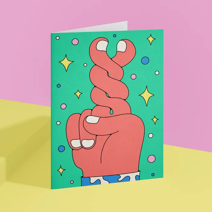 Illustration of a hand with crossed fingers on colorful card