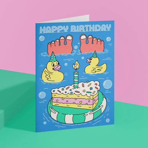 Colorful birthday card with cake, rubber ducks, and toes illustration
