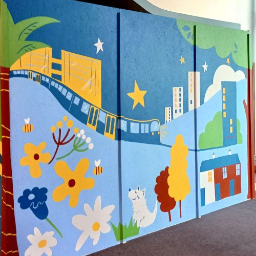 Brightly colored mural designed to engage visitors in a busy public space