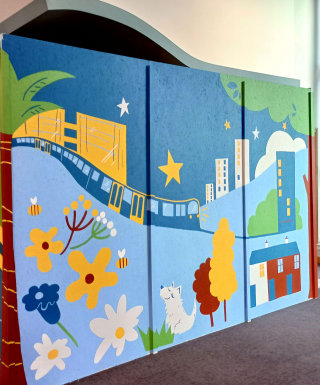 Brightly colored mural designed to engage visitors in a busy public space