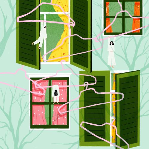 Pink hangers floating near open windows with green shutters