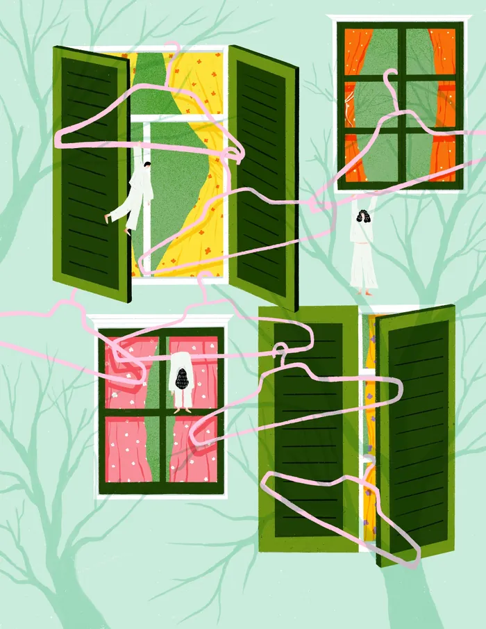 Pink hangers floating near open windows with green shutters