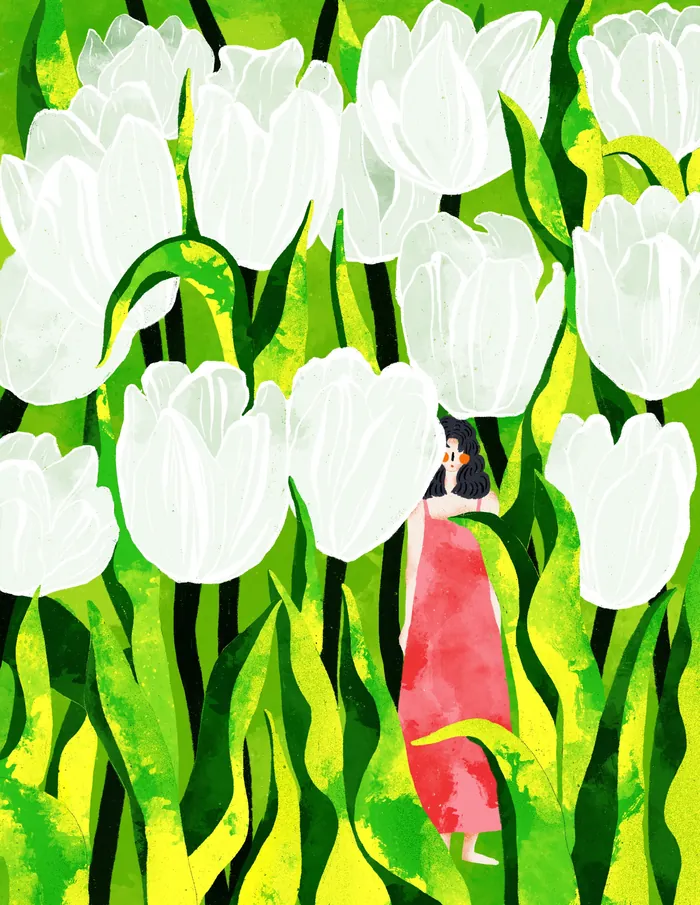 Woman in red dress among large white tulips in green field