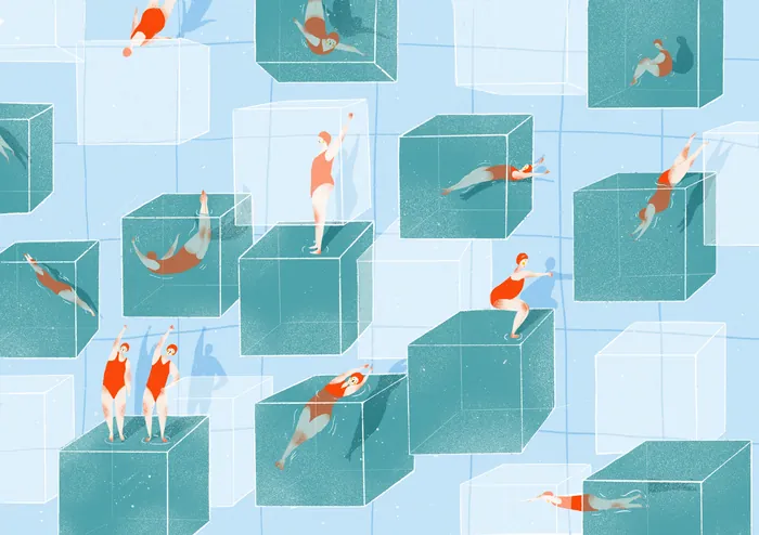 People swimming and diving in large transparent cubes in a pool