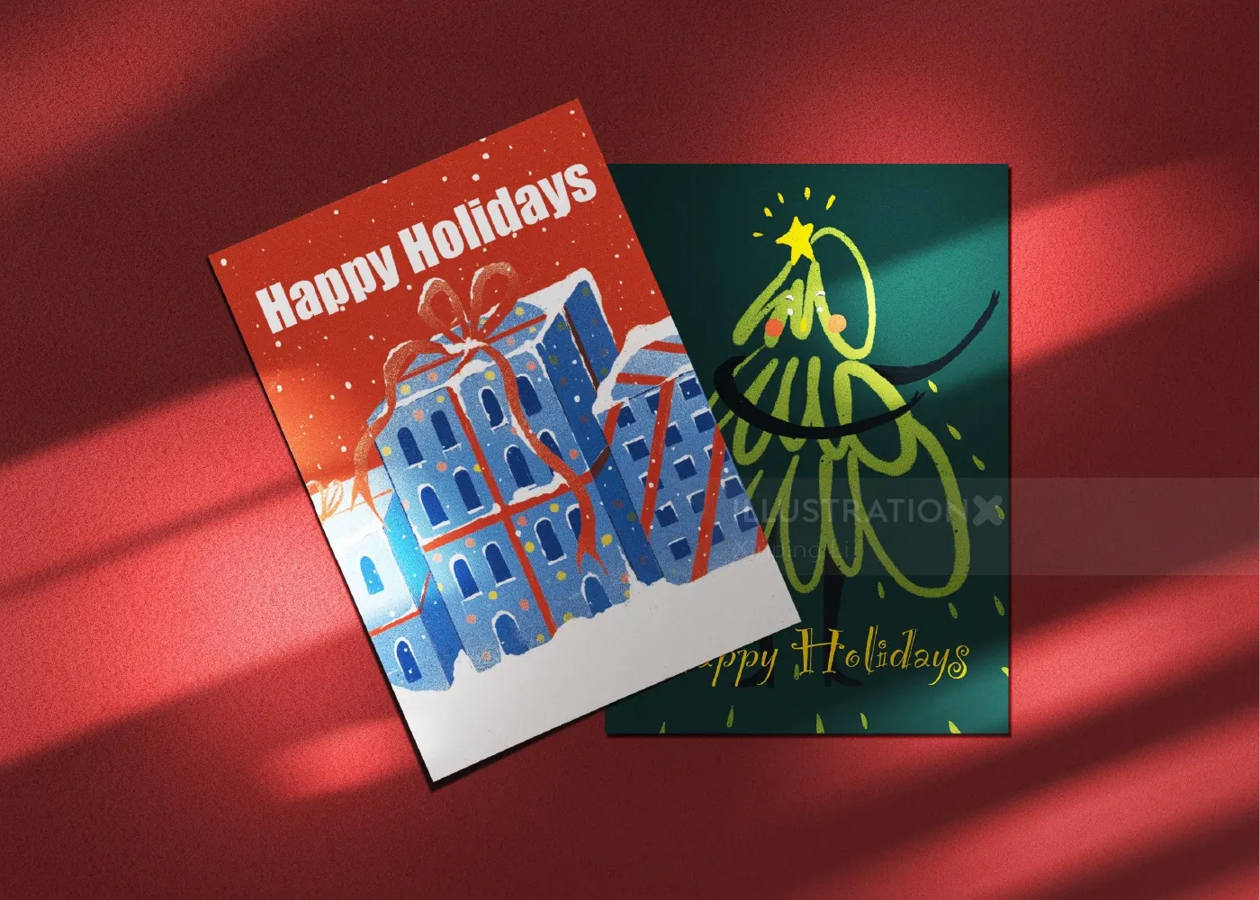 Two holiday greeting cards on red background, one with buildings, one with tree