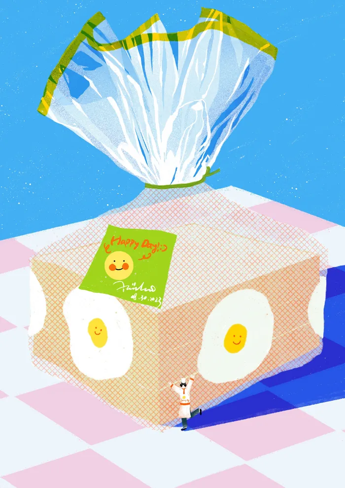 Loaf of bread with egg pattern on a checkered tablecloth