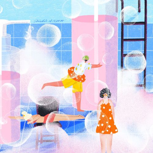 Children playing in a bubbly pool with large soap bubbles