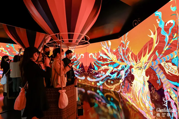 Visitors viewing immersive digital deer art installation by Yixin Zeng