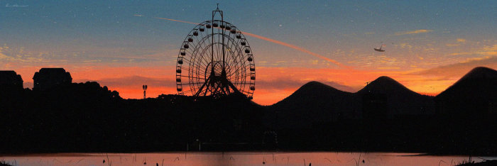 A ferris wheel against a sunset sky