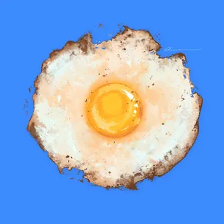 Fried egg with crispy edges on blue background
