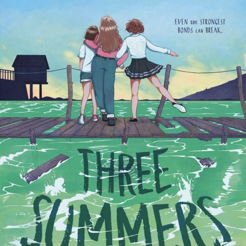 Three girls on dock looking at lake during sunset