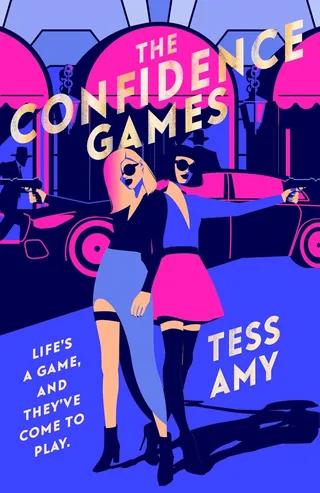 Two confident women posing in colorful city nightlife setting.