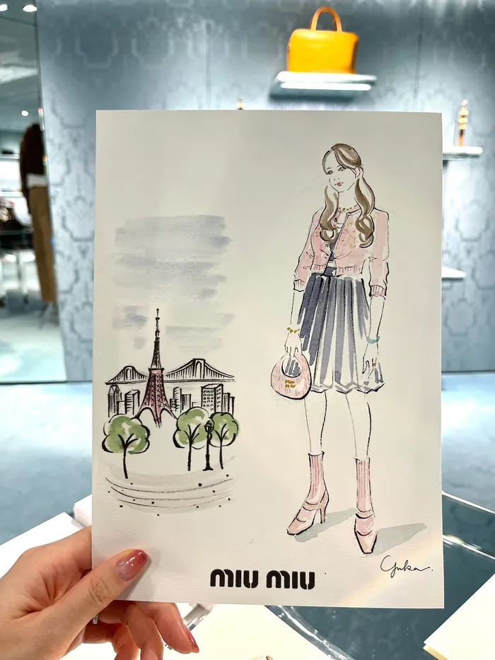 Fashion illustration of woman with Paris landmarks and handbag