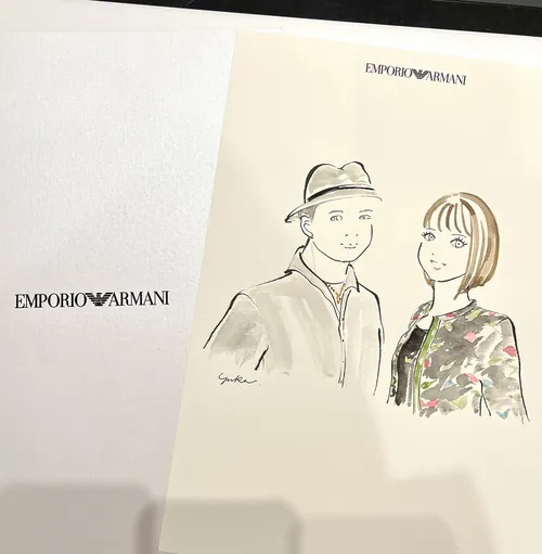 Sketch of a man and woman at an Emporio Armani event