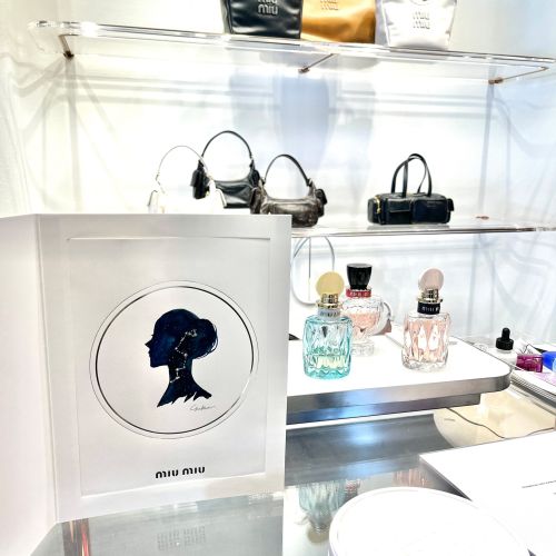 MIU MIU event display with handbags and perfume bottles
