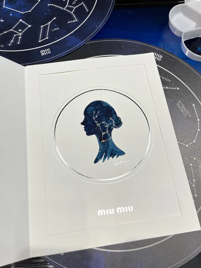Miu Miu event card with silhouette art and constellation background
