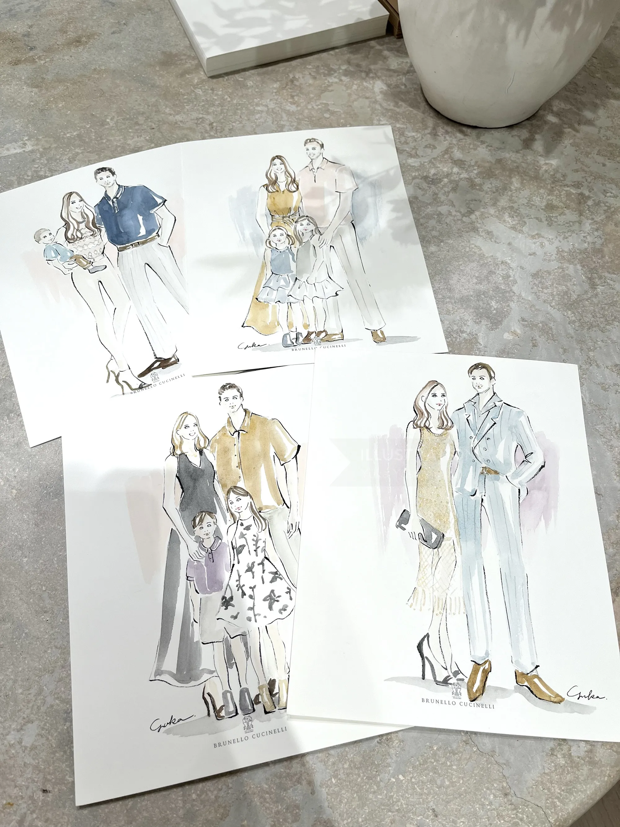 Fashion sketches of stylish models in various outfits on paper
