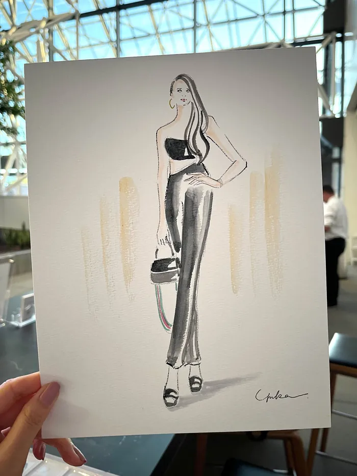 Fashion illustration of a woman in black outfit at LA Fashion Week