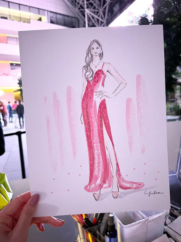Illustration of woman in red dress at fashion event