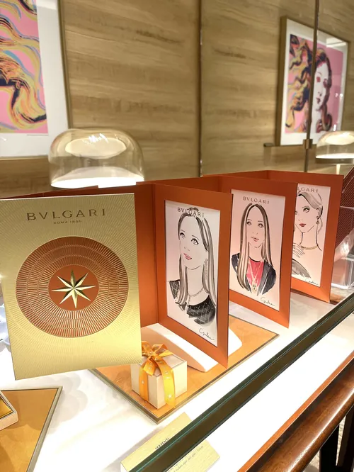 Bulgari event display with jewelry and illustrated portraits