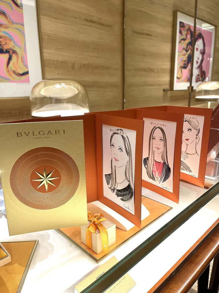 Bulgari event display with jewelry and illustrated portraits