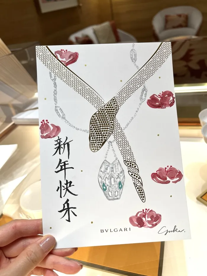 Bulgari jewelry artwork with snake necklace and floral design