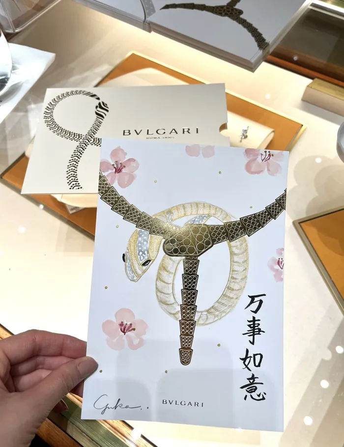 Bulgari jewelry design illustration with snake motif and floral accents