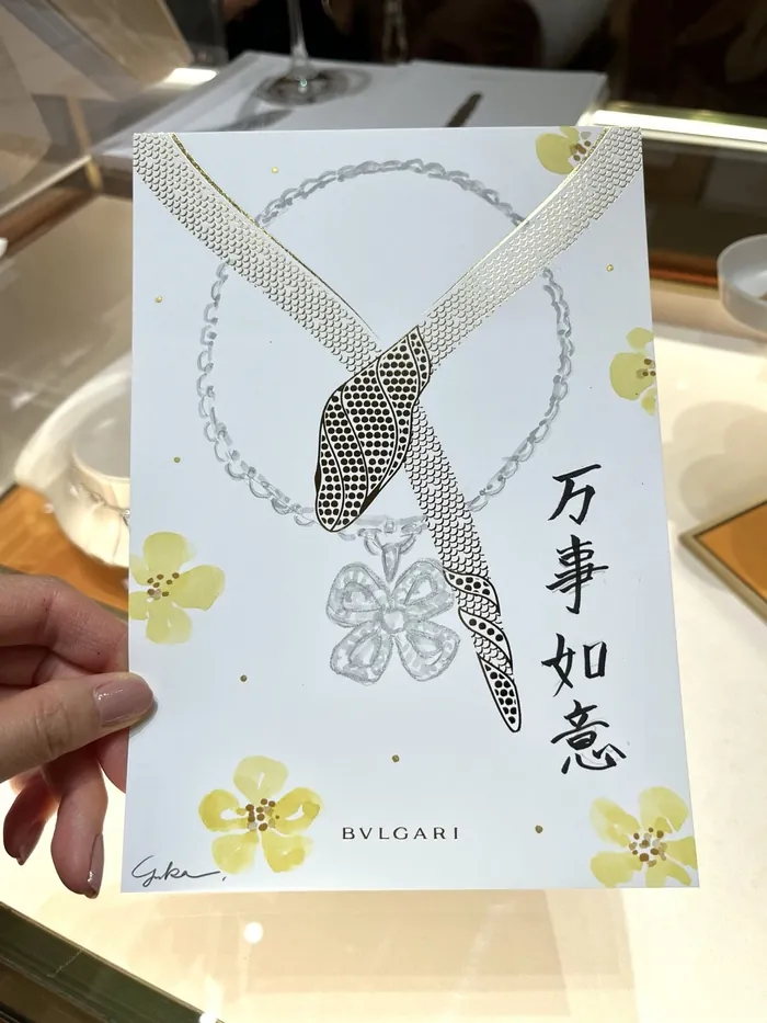 Bulgari snake necklace illustration on floral card with Chinese characters