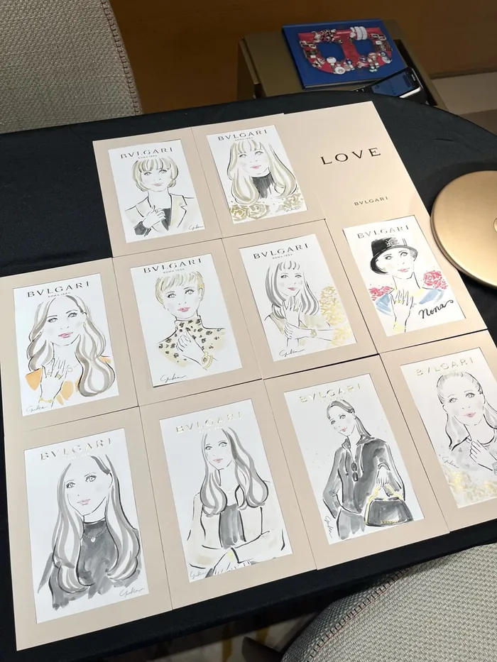 Illustrated portraits displayed on table at Bulgari event
