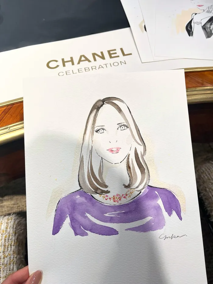 Watercolor portrait of woman in purple top with Chanel Celebration text
