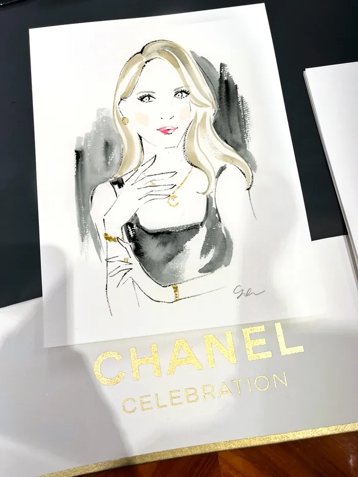 Stylized sketch of a woman with gold jewelry and Chanel branding