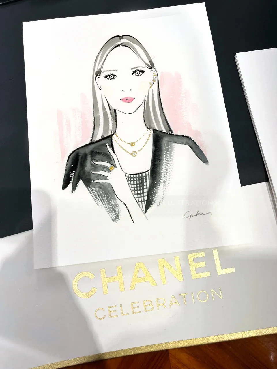 Fashion illustration of a woman in Chanel outfit with necklace