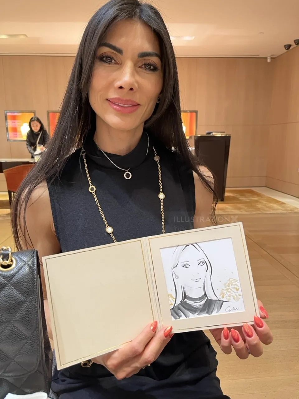 Woman holding a sketch at Bulgari live event