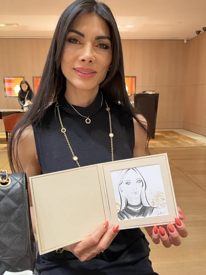 Woman holding a sketch at Bulgari live event