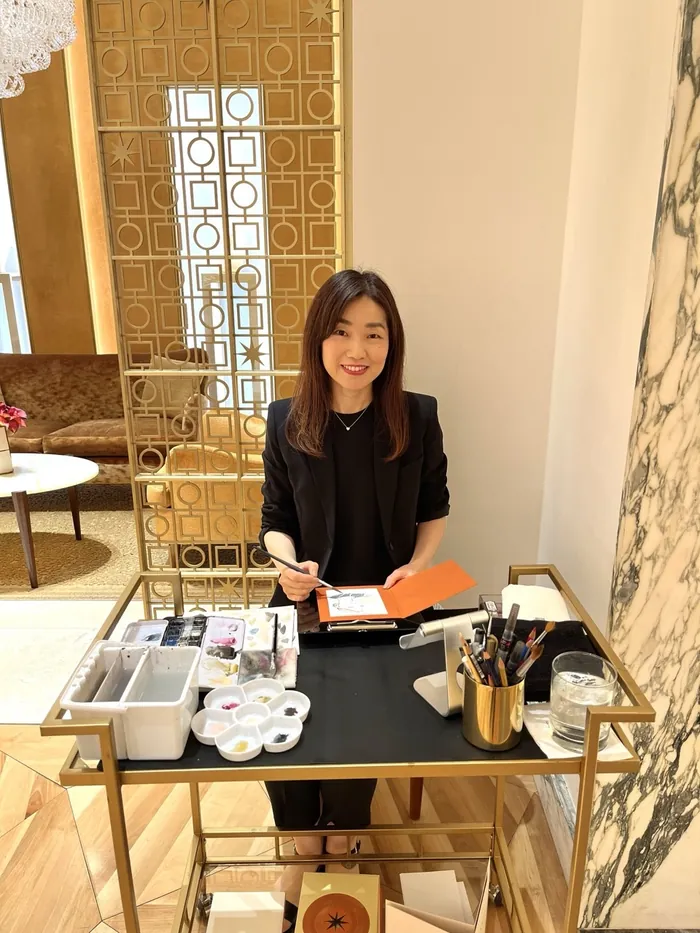Woman presenting jewelry at Bulgari live event desk