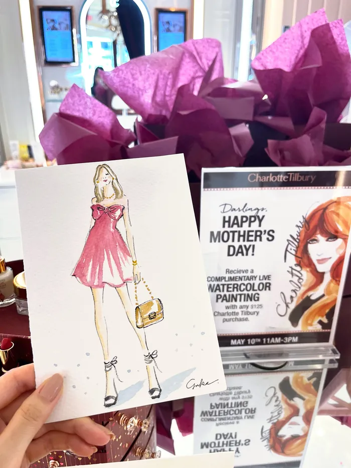 Sketch of woman in pink dress holding handbag with event posters
