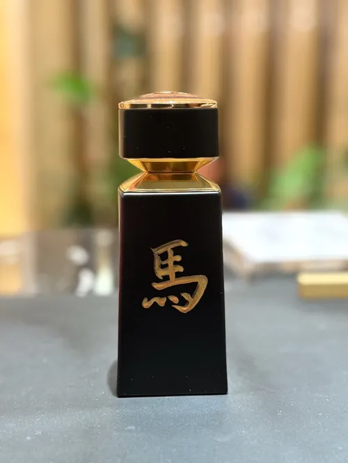 Black bottle with gold calligraphy by Yuka Yasutomi Live Events