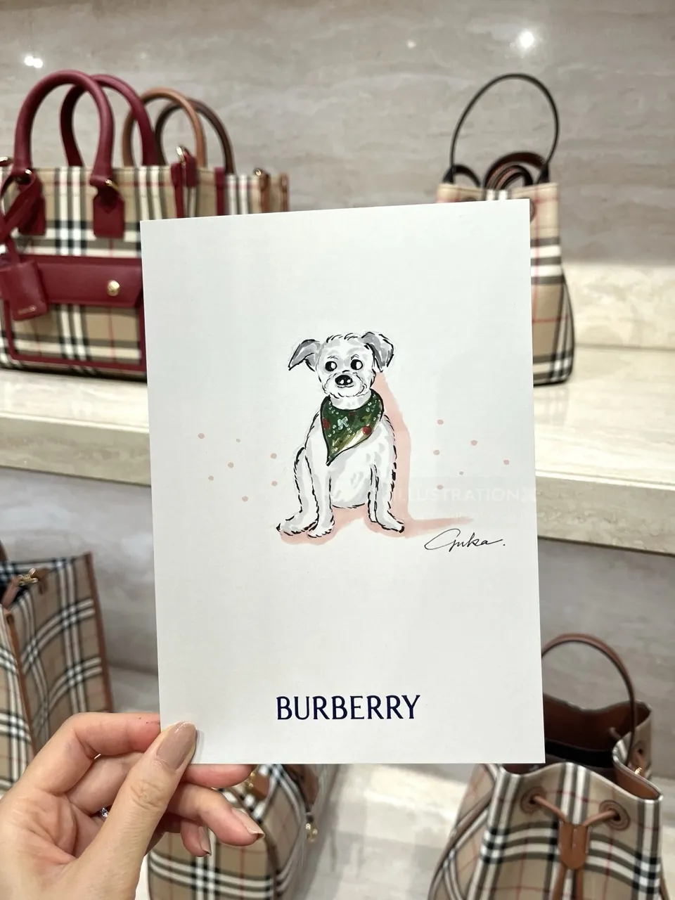 Burberry shopping bag featuring a dog illustration by Yuka Yasutomi
