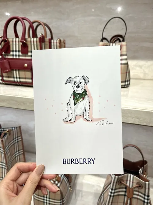 Burberry shopping bag featuring a dog illustration by Yuka Yasutomi