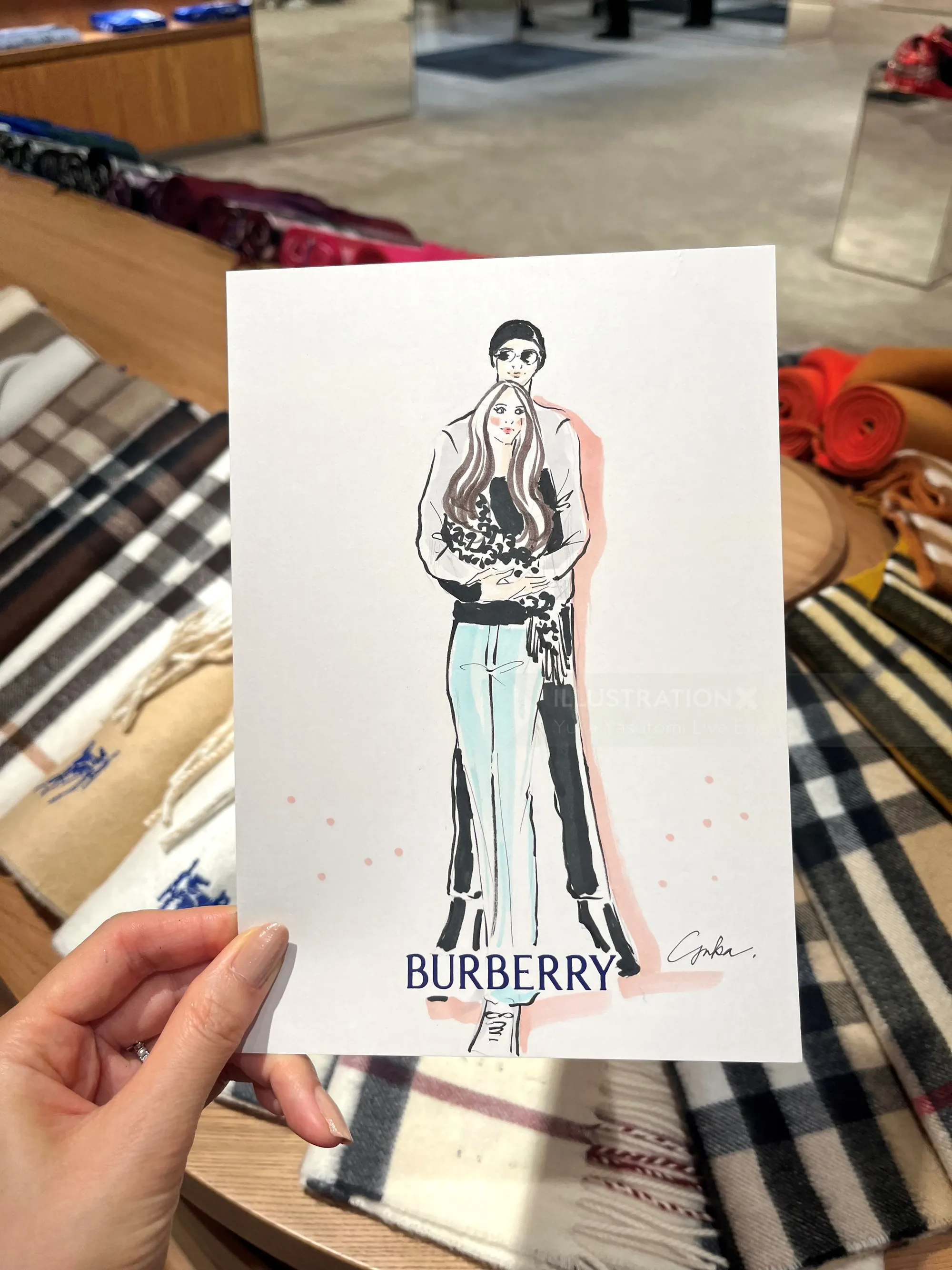 Fashion illustration of a model wearing Burberry, by Yuka Yasutomi