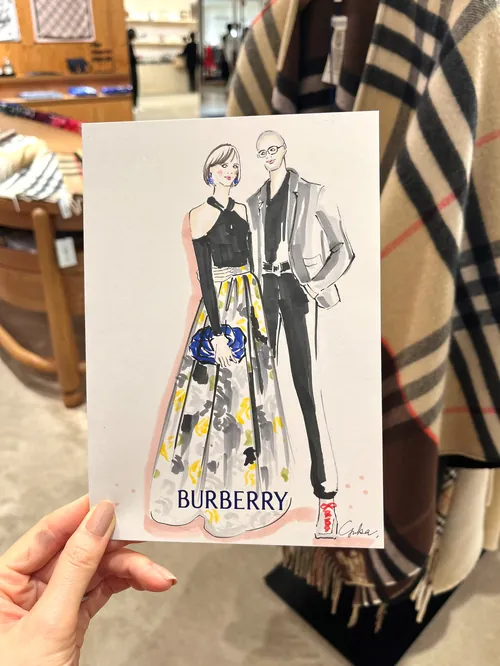 Fashion illustration of a man and woman wearing Burberry outfits by Yuka Yasutomi