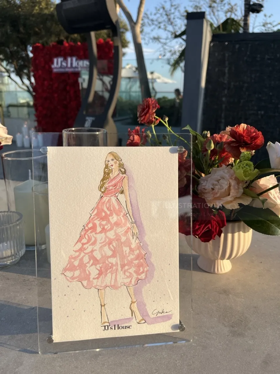 Fashion illustration of a woman in pink dress by Yuka Yasutomi