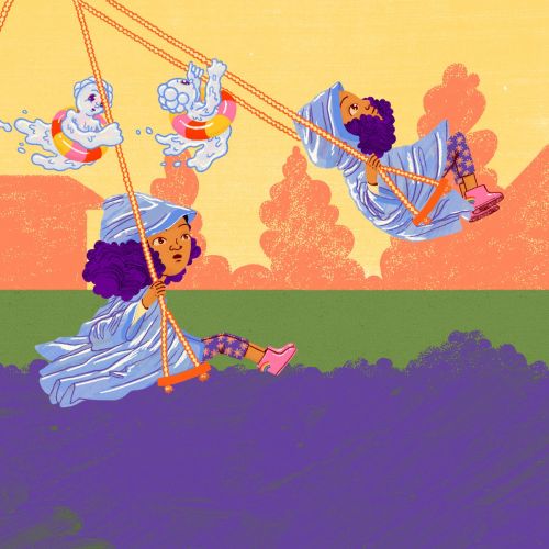 Children playing on swings with one child pushing others outdoors