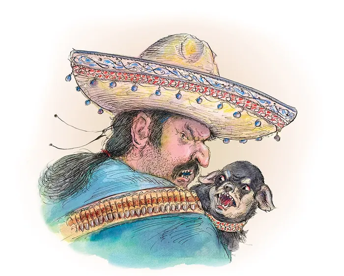 Man wearing a decorated sombrero carrying a small dog on his shoulder
