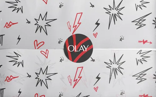 Olay logo surrounded by lightning bolts, stars, and hearts by Nadia Flower
